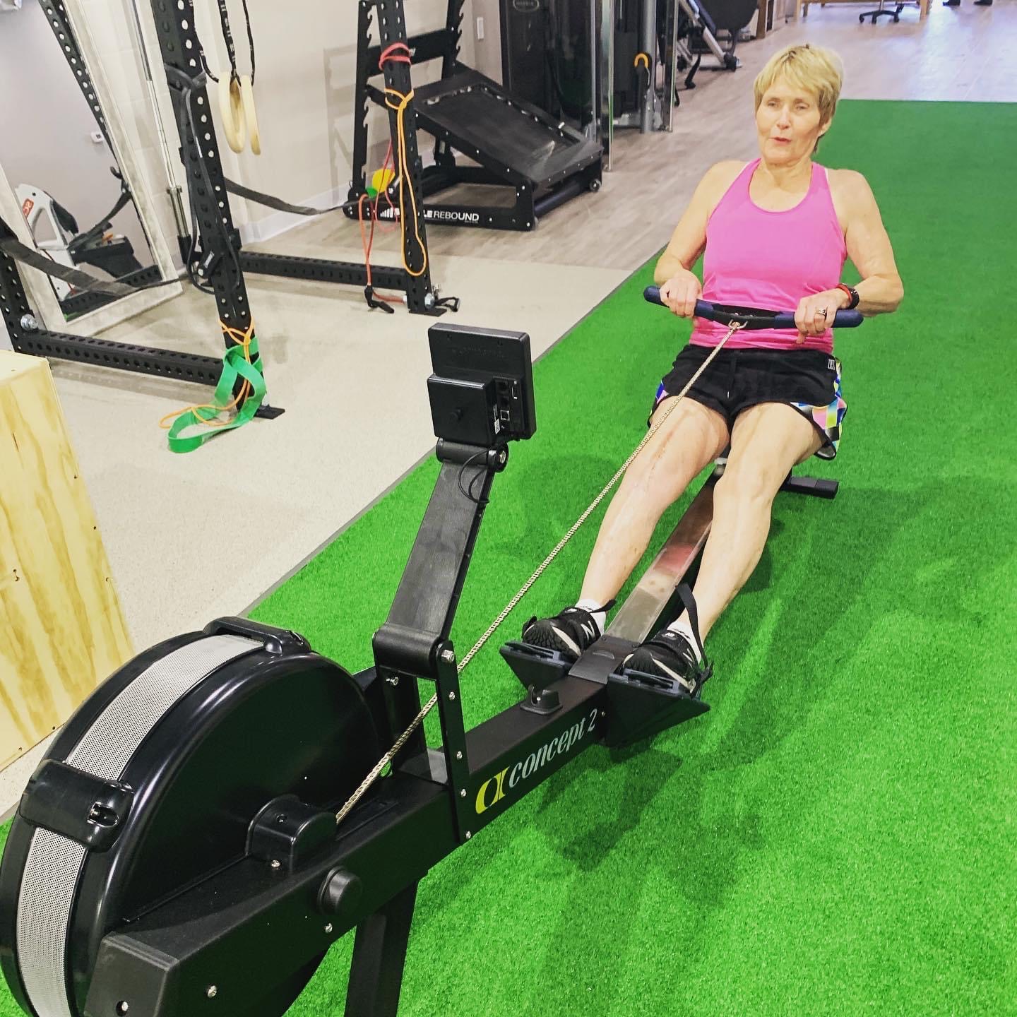 A female patient uses fitness equipment to carry out an physical therapy exercise at PRIME Physical Therapy.