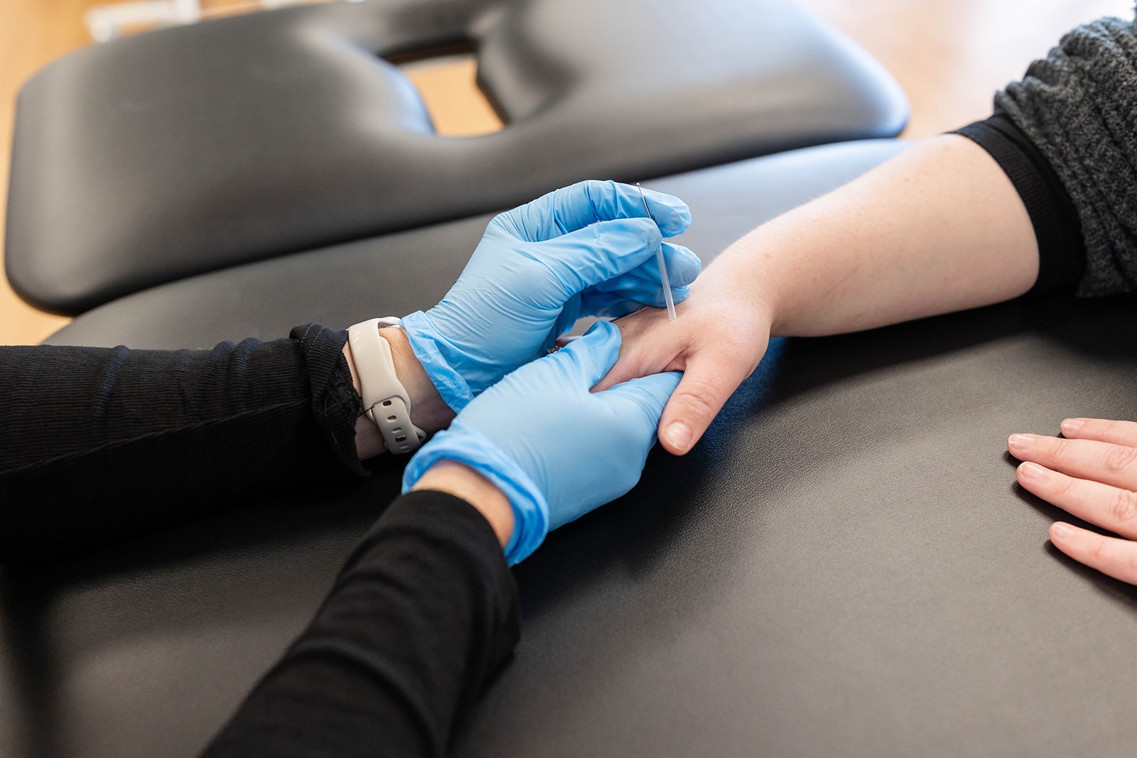 Dr. Laura Yoo treats a patient's shoulder at PRIME Physical Therapy clinic in Eldersburg, Maryland.
