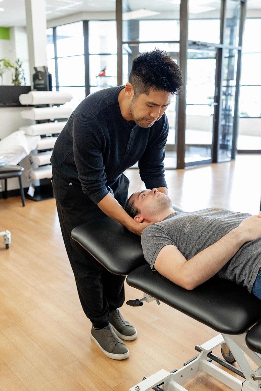 Dr. Won Yoo, owner and operator of PRIME Physical Therapy, treats a patient at their clinic in Eldersburg, Maryland.