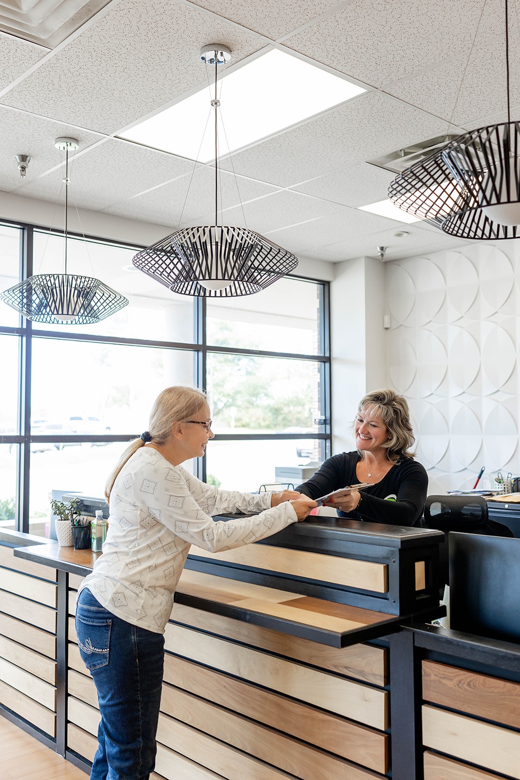 Dr. Won Yoo treats a pediatric patient with her mom at PRIME Physical Therapy in Eldersburg, Maryland.