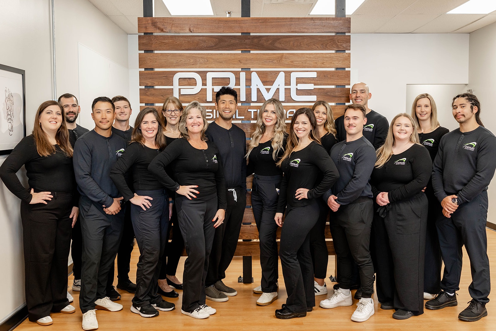 PRIME Physical Therapy clinic and gym with treatment tables, decorative plants, treatment equipment, and privacy wall for aqua therapy