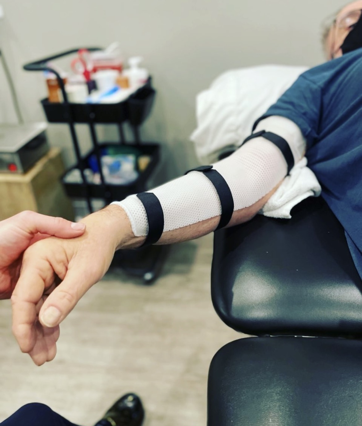 A patient finds relief using the Normatech technique to treat her condition at PRIME Physical Therapy.