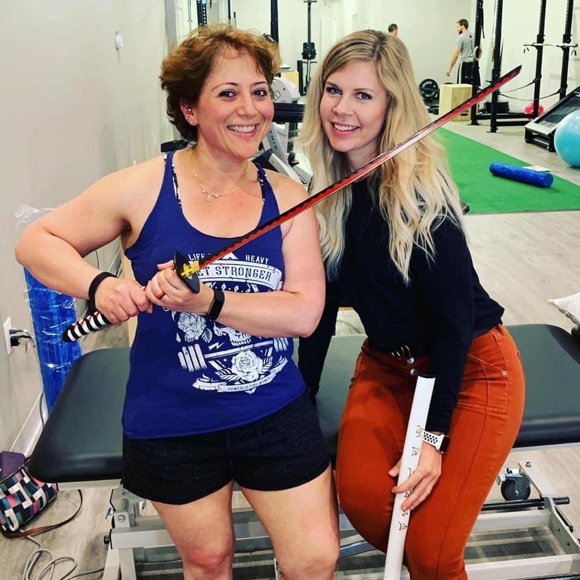 Chamption powerlifter and PRIME Physical Therapy regular Anjuli Bhat-Mejia and Dr. Laura Yoo share a laugh.